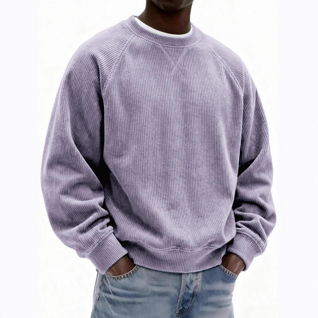 Person wearing a light purple corduroy sweatshirt on a white background