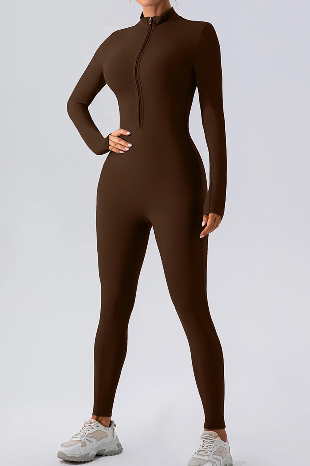 one piece activewear jumpsuit half zip mock neck full length silhouette for travel days, warmups and cool downs
