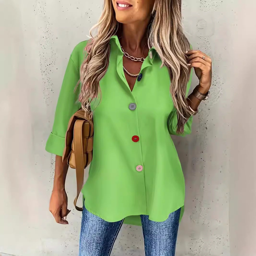 Woman wearing a bright green shirt with a neutral background