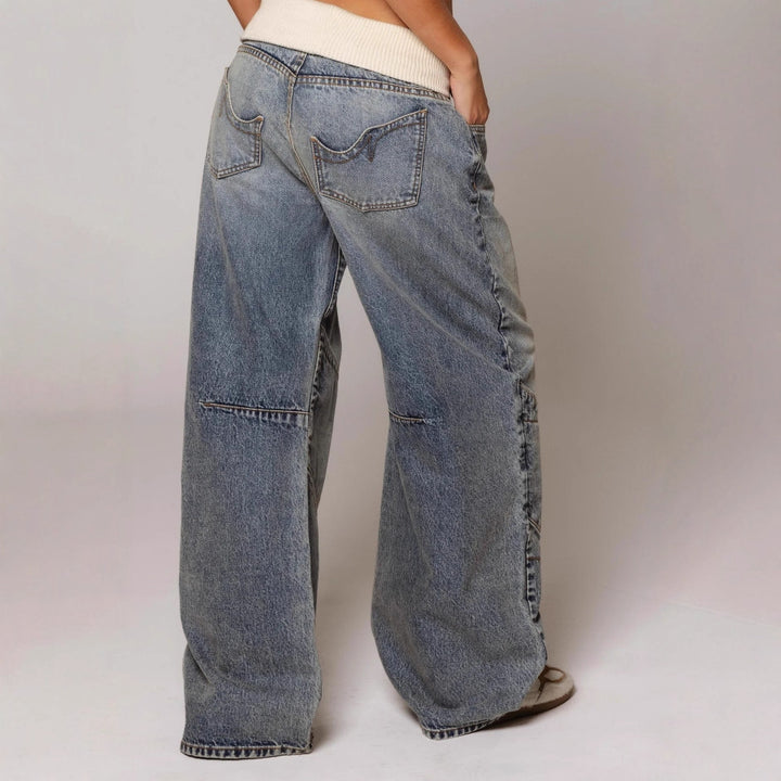 Polyester jeans-style pants with loose fit and pocket detail