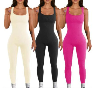 Three women wearing different colored jumpsuits on a white background