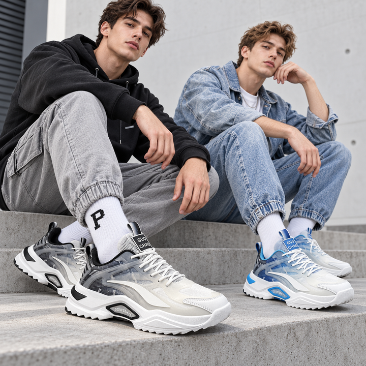 Two male models wearing the verified white and black and white and blue dad sneakers on concrete steps with strong focus on the shoes.