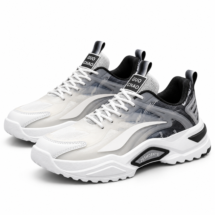 Dad sneakers for men in white and black with thick sculpted soles, layered upper, white laces and low-top casual sneaker shape.