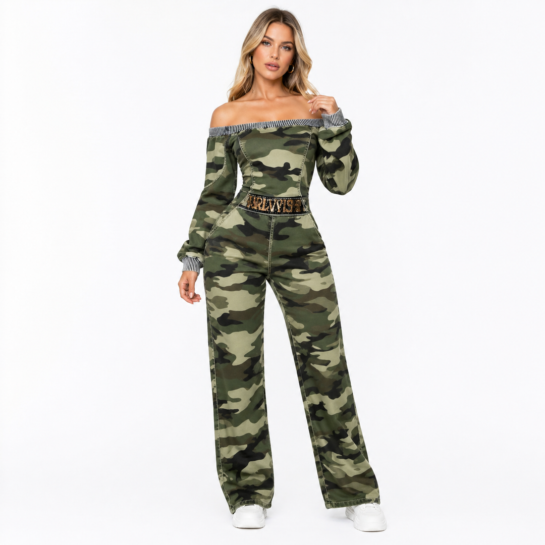 Model wearing a camo off-shoulder jumpsuit with long sleeves and wide legs on a clean studio background