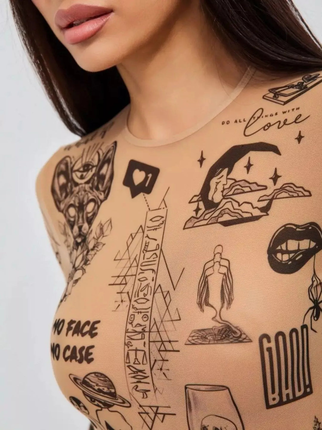 Detail shot of stretch mesh fabric and tattoo-style print on a women&