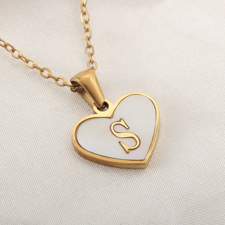 Gold-plated alphabet necklace with heart letter pendant, stainless steel construction and 45+5 cm chain - Buyer product view.