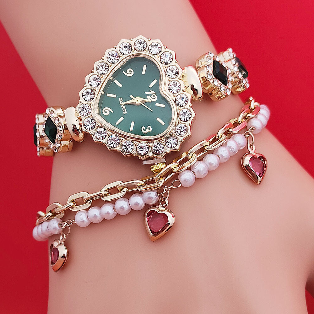 Valentine’s Day heart watch gift set showing gold heart bracelet watch, pearl chain and red heart charms styled together