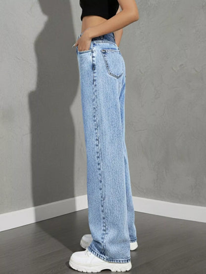high rise wide leg jeans close-up of button closure and waistband stitching light wash rigid denim for structured fit
