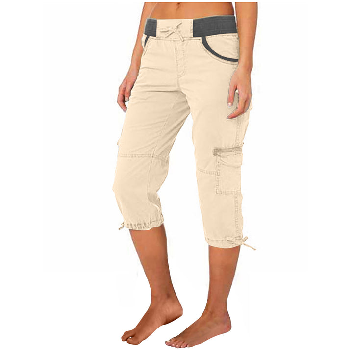Beige capri pants worn by a person on a white background