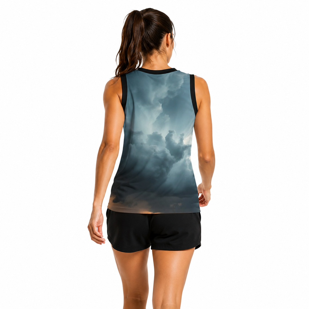 Woman wearing a sleeveless shirt with cloud pattern and black shorts on a white background
