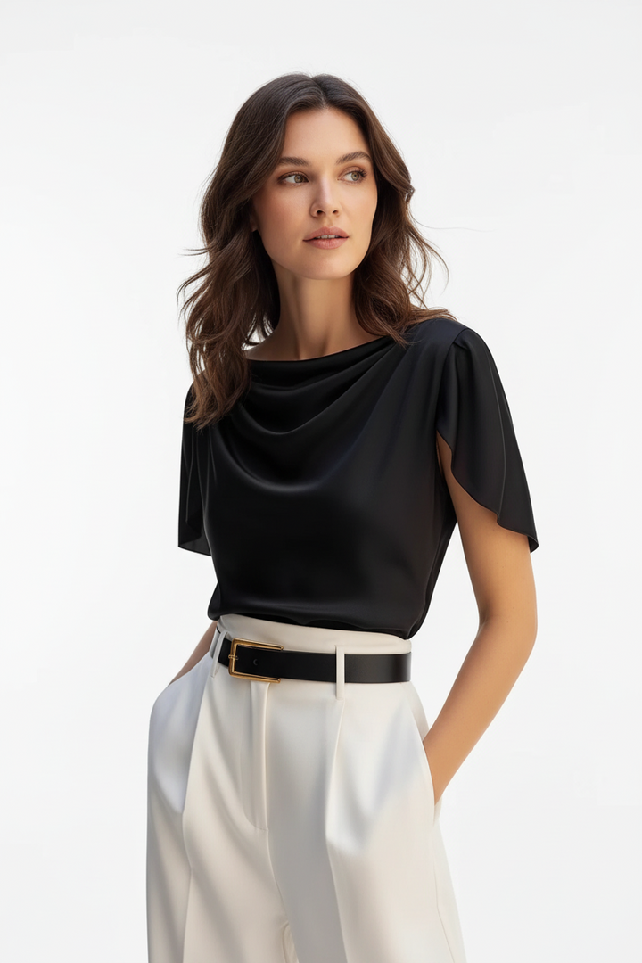 Close-up of scoop neckline detail on black polyester puff sleeve women&