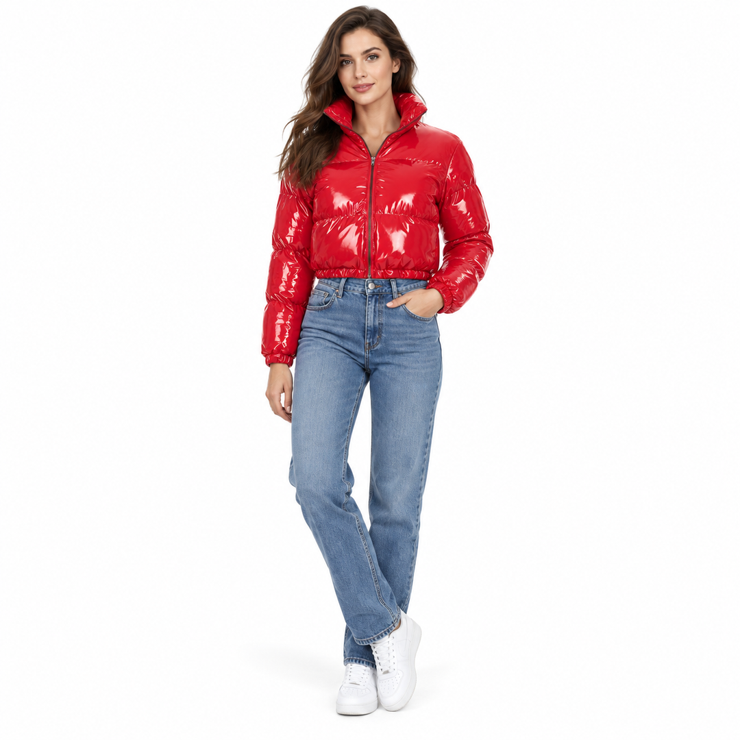 Model wearing the red zip-front cropped jacket with blue jeans and white sneakers.