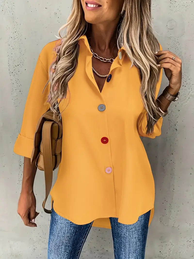 Woman wearing a yellow blouse with a neutral background