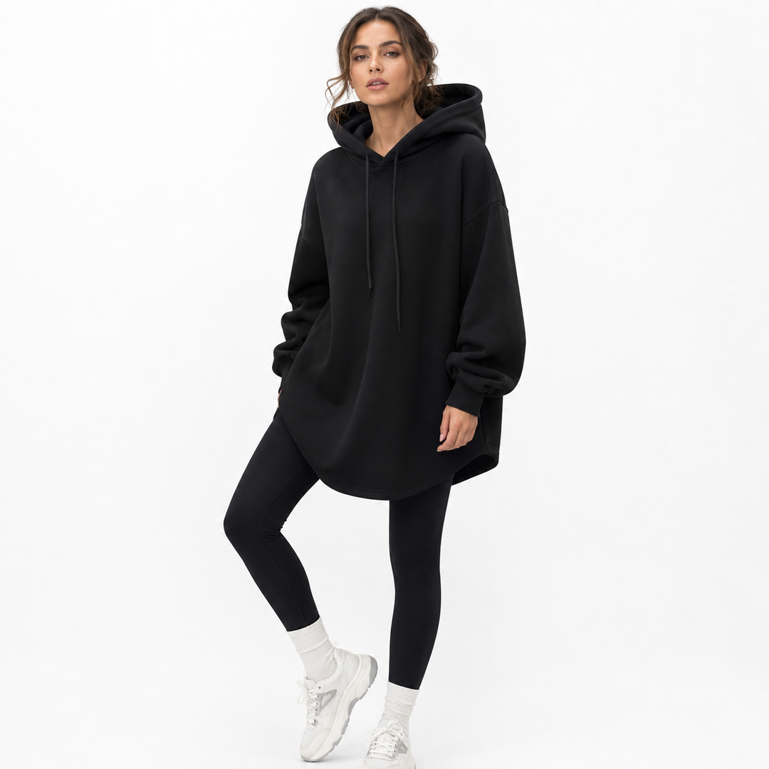 Longline loose hoodie styled with fitted pants for everyday streetwear