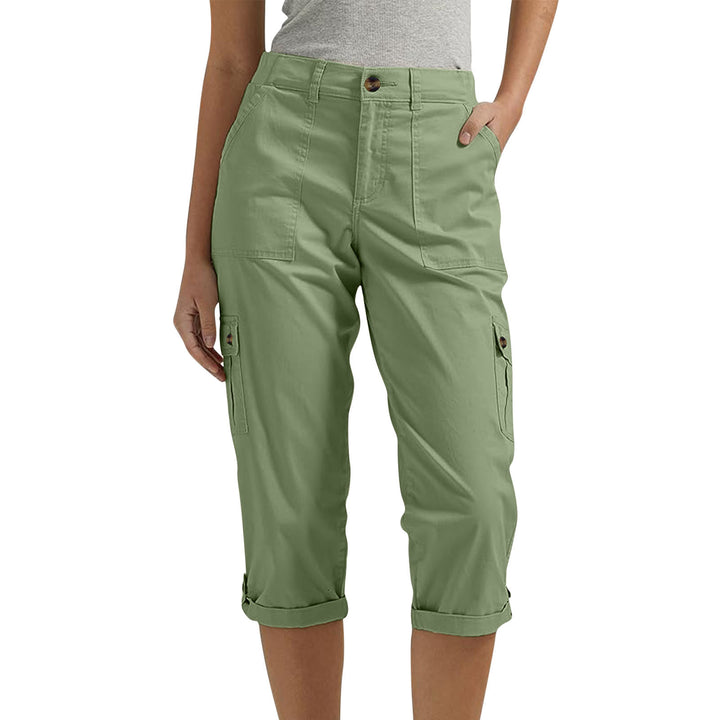Green cargo pants worn by a person on a white background