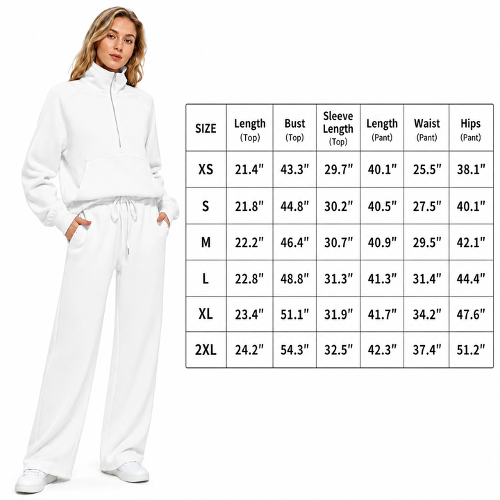 A woman modeling a white zip-front sweatshirt and matching sweatpants next to a size measurement chart showing dimensions for sizes XS through 2XL.
