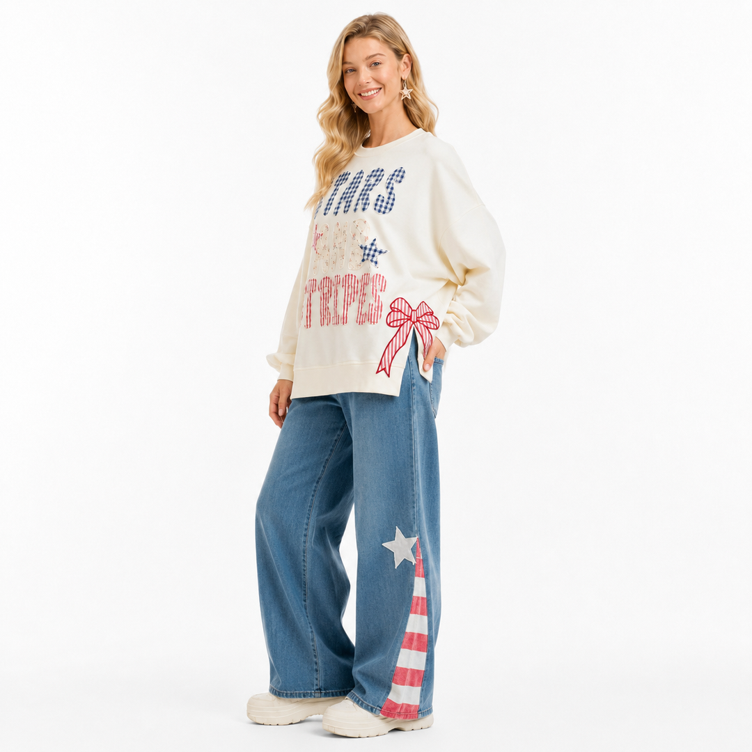 Soft stars and stripes pullover for women with ribbed hem, pocketed feature and festive patchwork design for casual wear now!