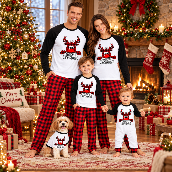 Family wearing coordinated holiday pajamas in a decorated room
