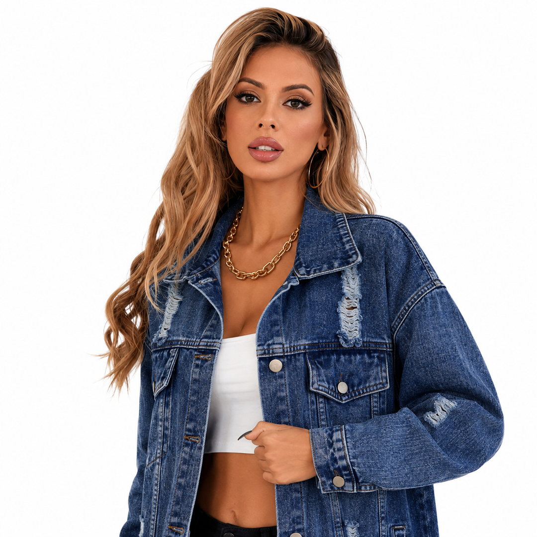 Blue denim jacket close-up showing dark wash, collar, chest pockets, buttons and distressed details