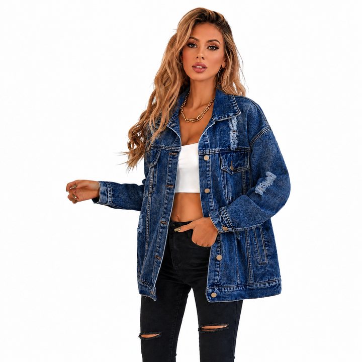 Blue distressed denim jacket on female model with loose fit, long sleeves and casual front view