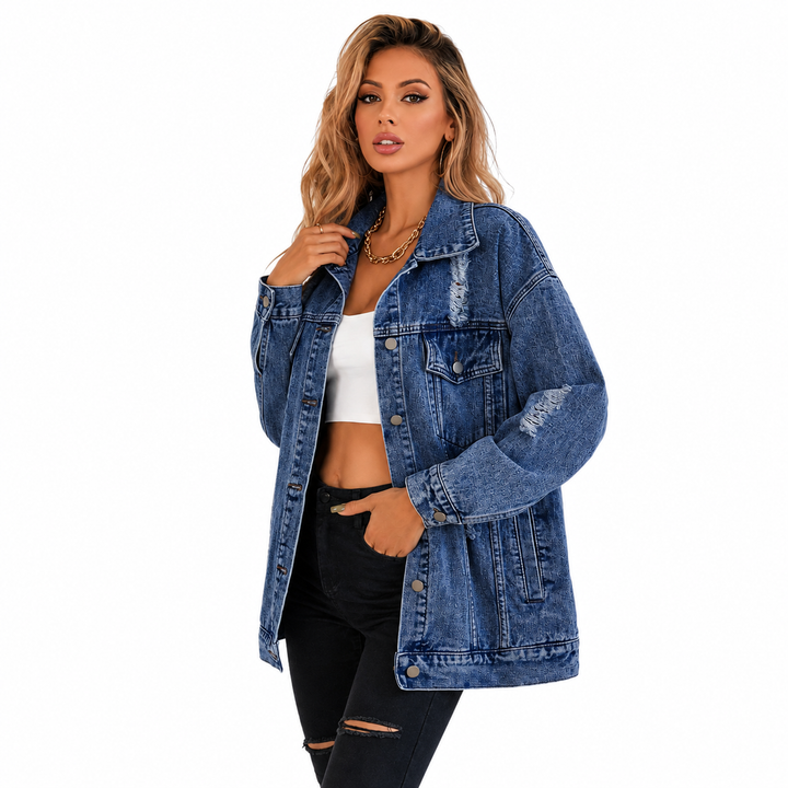 Blue loose fit denim jacket side pose showing dark wash, sleeve shape and distressed styling