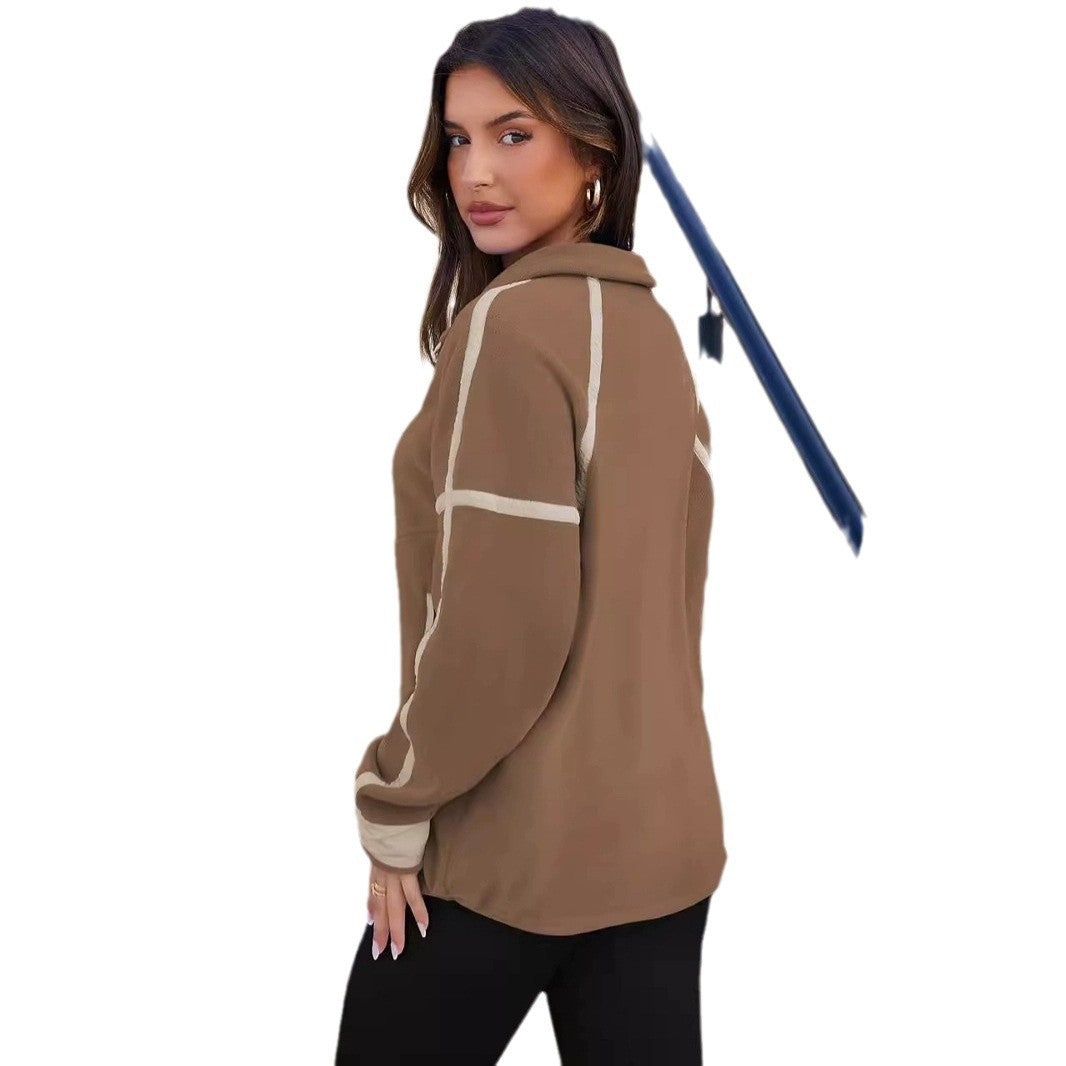 Woman wearing a brown hoodie with white accents on a white background