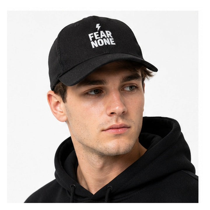 Close-up of Fear None embroidered black denim cap on male model