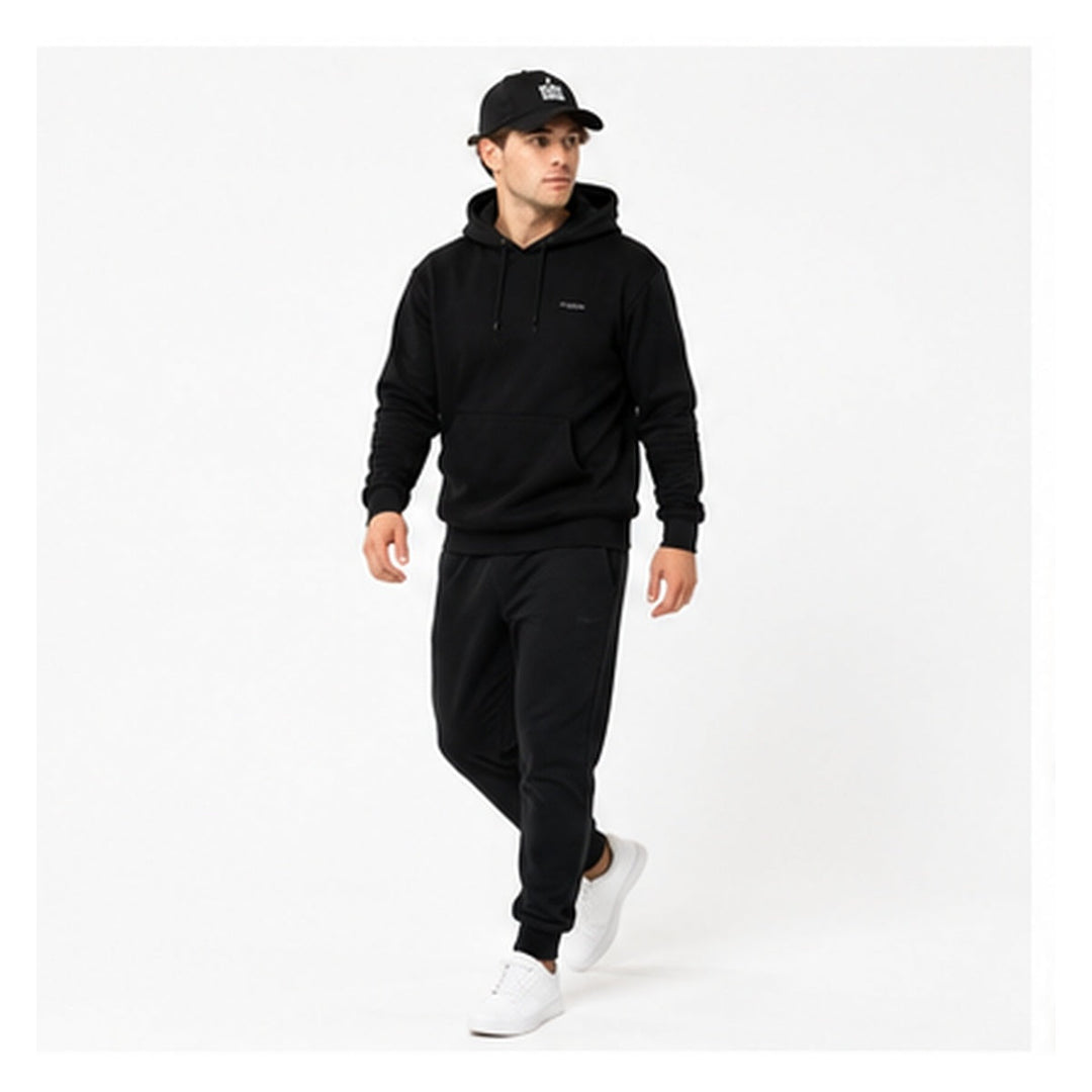Fear None embroidered denim cap on male model in walking studio pose