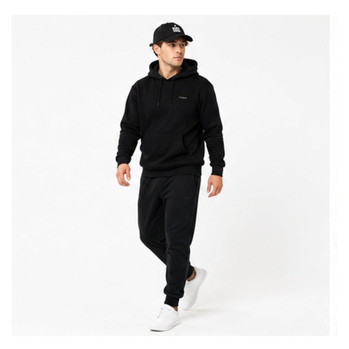Fear None embroidered denim cap on male model in walking studio pose