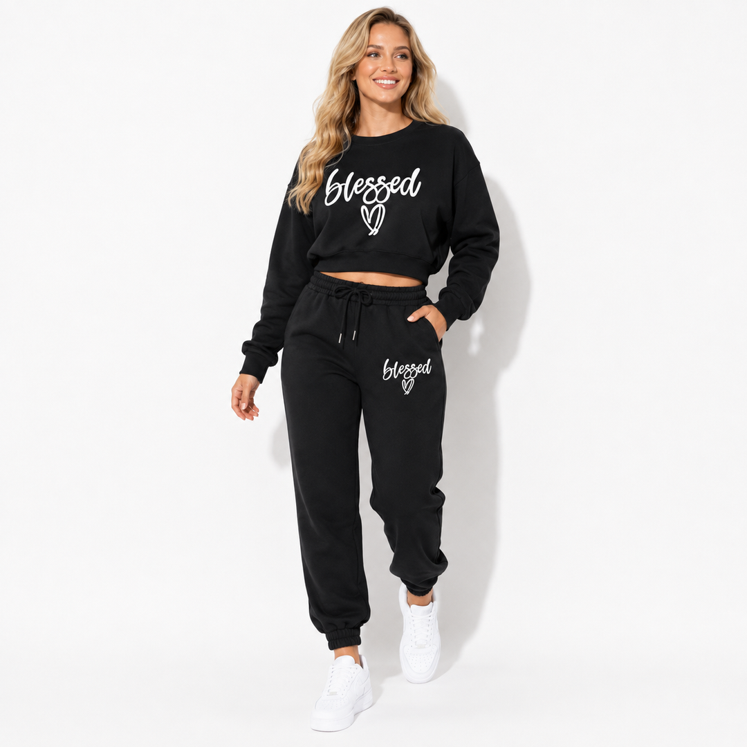 Black fleece two-piece jogger set in a natural walking pose