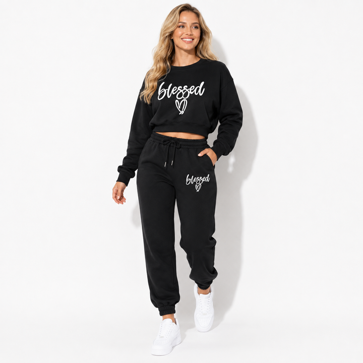 Black fleece two-piece jogger set in a natural walking pose