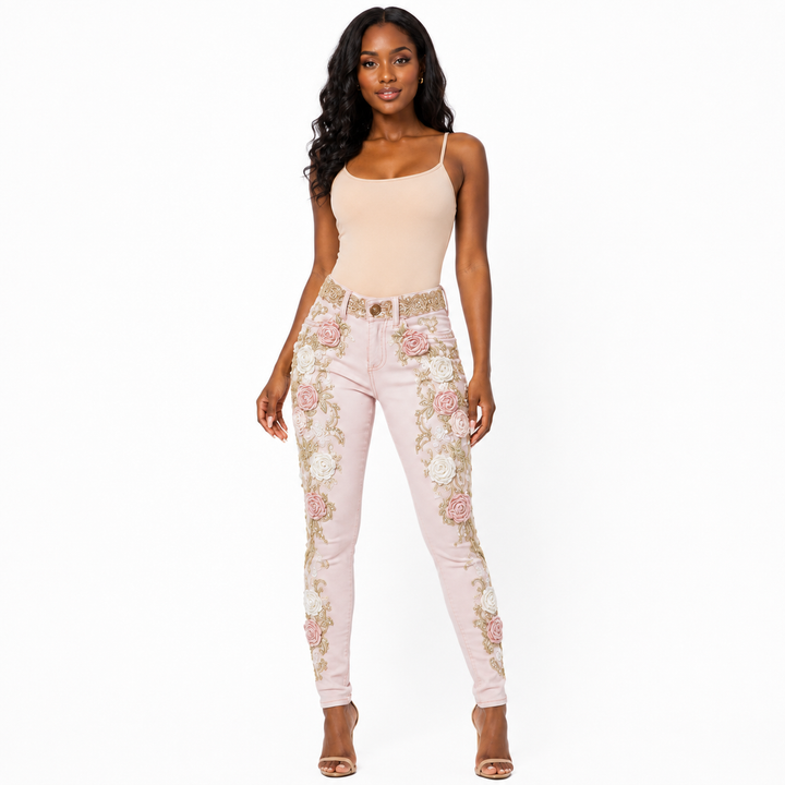 Pink floral embroidered jeans with rose appliques and gold details - hero front view on Black woman model