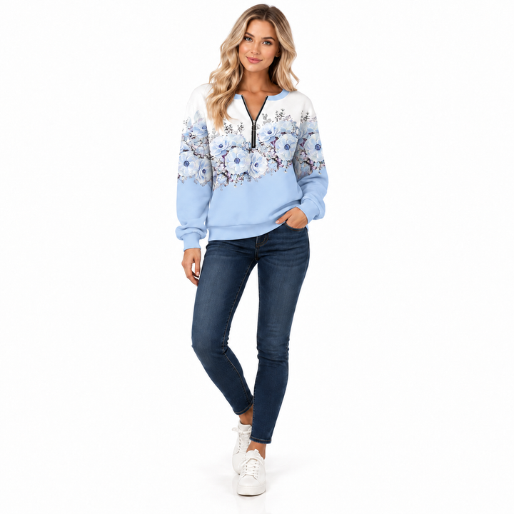 Light blue floral half zip pullover on model, front view