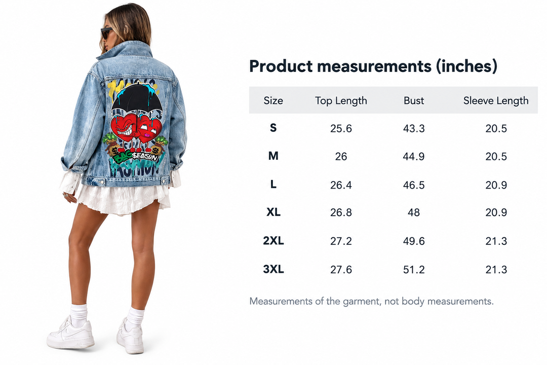 A model wearing a light blue denim jacket with a colorful cartoon graphic on the back, shown next to a product measurements chart listing sizes S through 3XL with top length, bust, and sleeve length in inches.