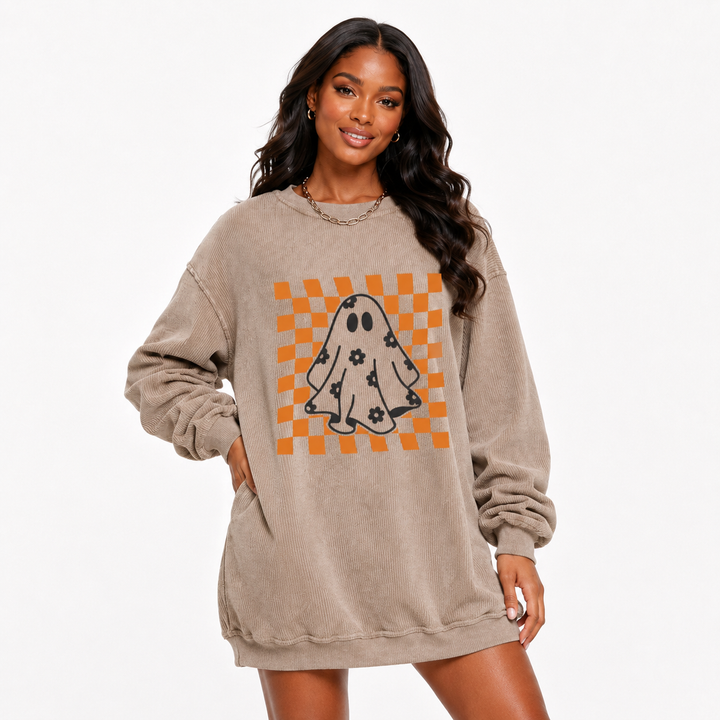 Halloween Ghost Sweatshirt showing relaxed oversized fit and bold orange checkerboard ghost graphic