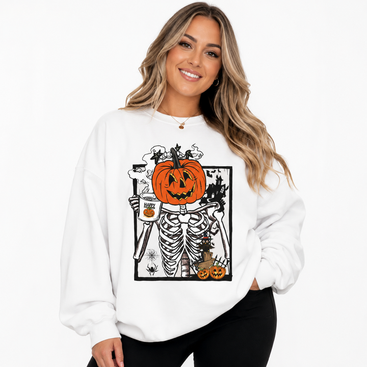 Woman wearing white Halloween pumpkin sweatshirt with pumpkin skeleton graphic on a clean white studio background.