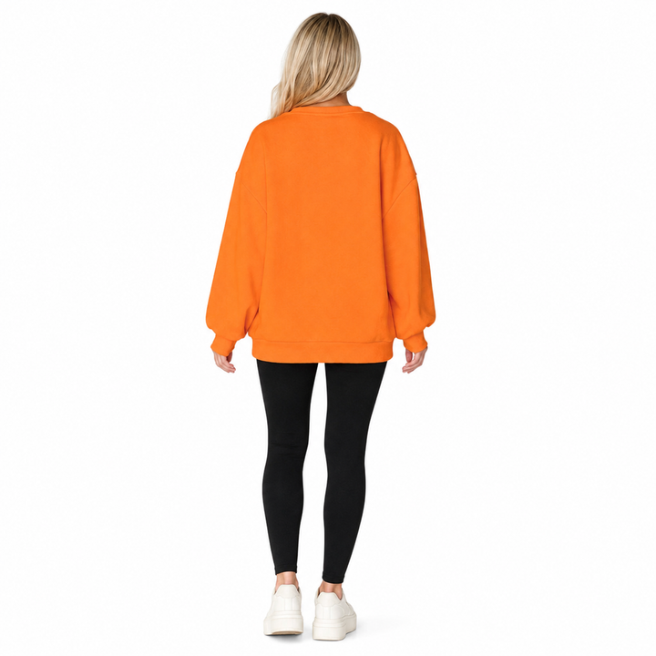 Women’s orange Halloween sweatshirt - full back view showing plain back and relaxed oversized fit