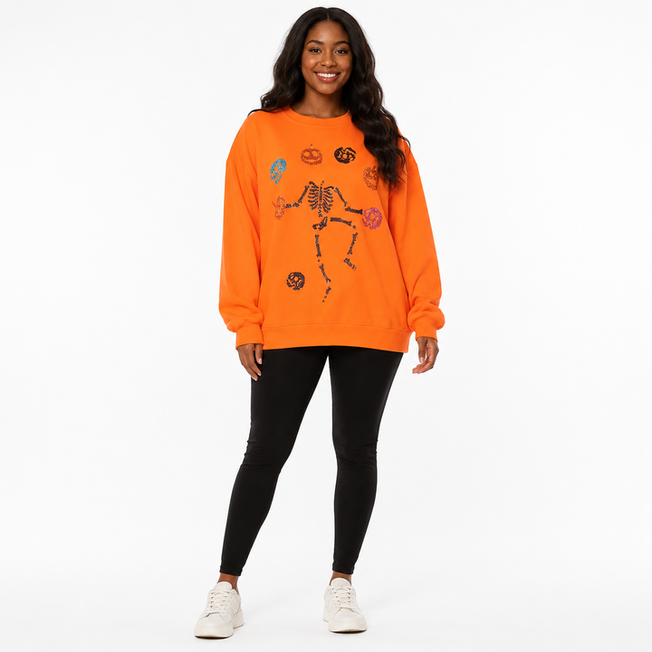 Women’s orange Halloween Skeleton Pumpkin sweatshirt - full front view showing relaxed oversized fit