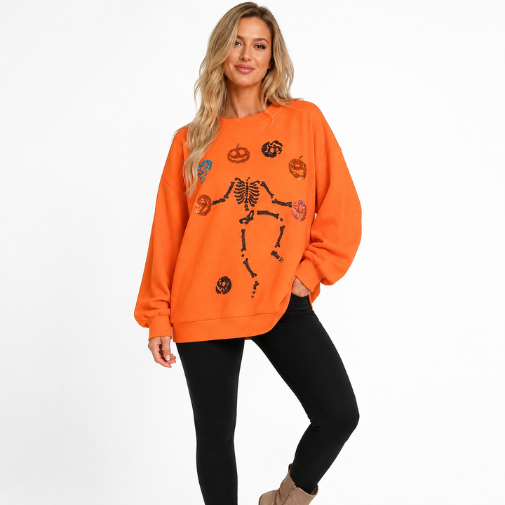 Women’s Halloween Skeleton Pumpkin sweatshirt - clean lifestyle styling with orange oversized crewneck