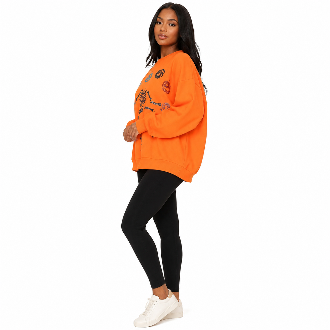Orange Halloween Skeleton Pumpkin women’s sweatshirt - side view showing loose silhouette and sleeve volume