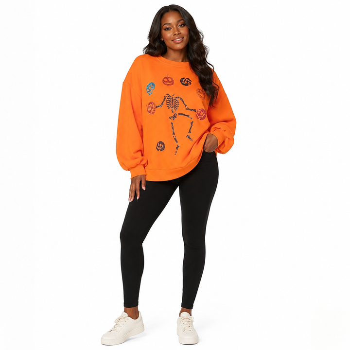 Halloween Skeleton Pumpkin sweatshirt for women - three-quarter view with sequin skeleton and pumpkin graphic