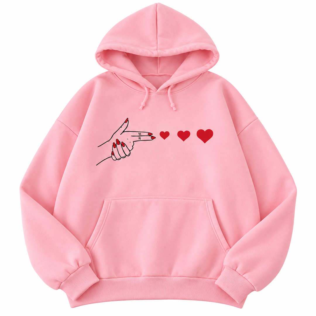 Pink hoodie with hand and red heart graphic, isolated front view