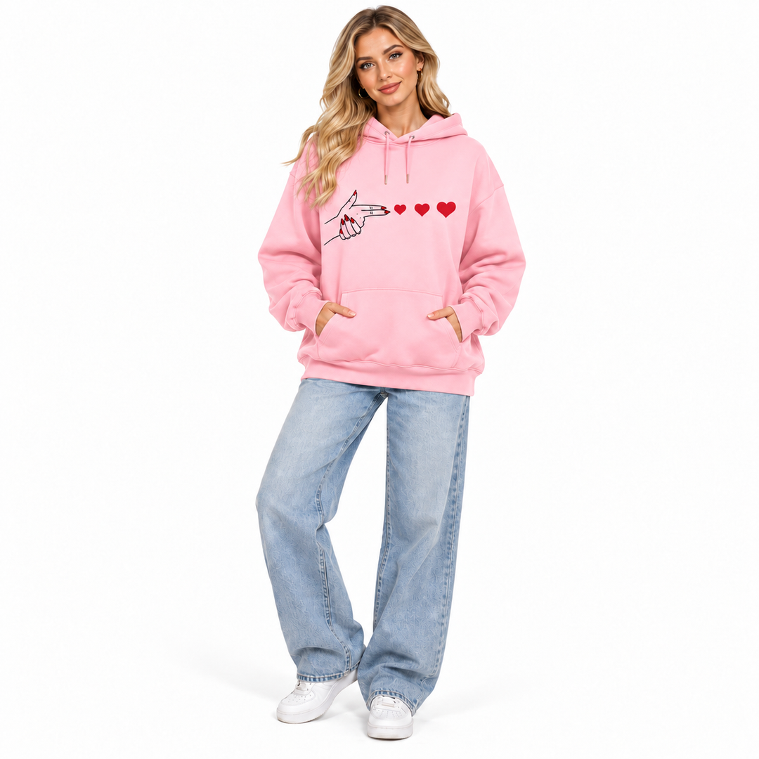 Pink heart graphic hoodie on model, full front view