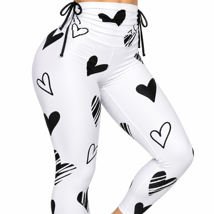 Close-up of white fabric with mixed black heart print pattern