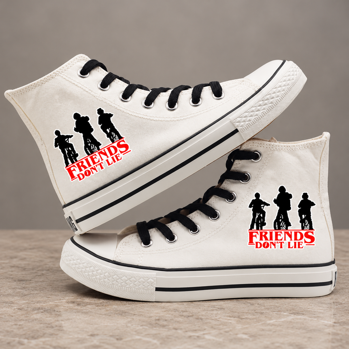 White high-top sneakers, design 3, with the original side graphic on a warm gray studio background