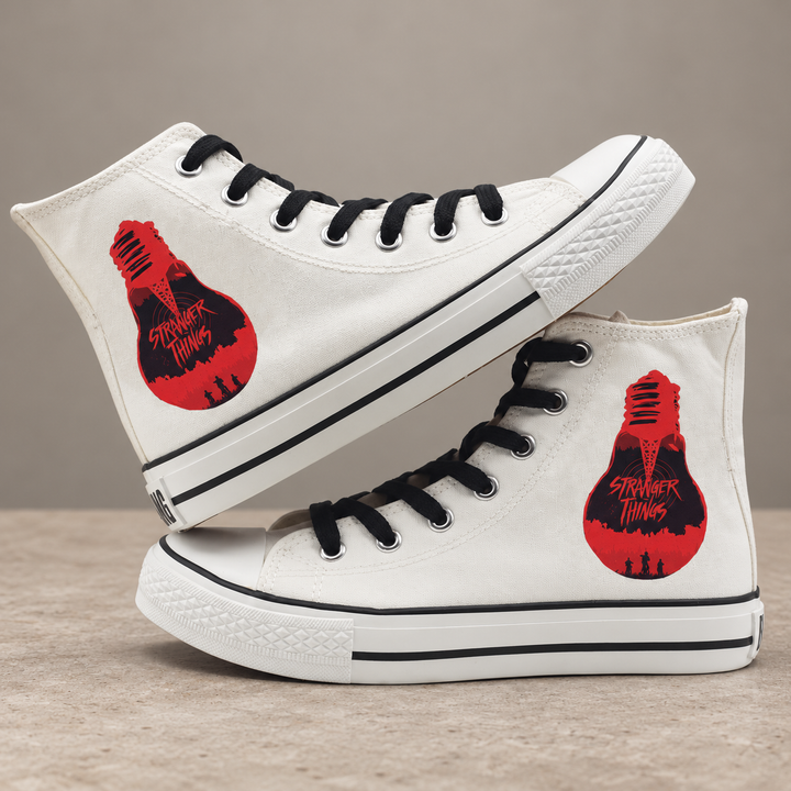 White high-top sneakers, design 4, with the original side graphic on a warm gray studio background