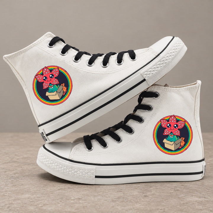 White high-top sneakers, design 5, with the original side graphic on a warm gray studio background