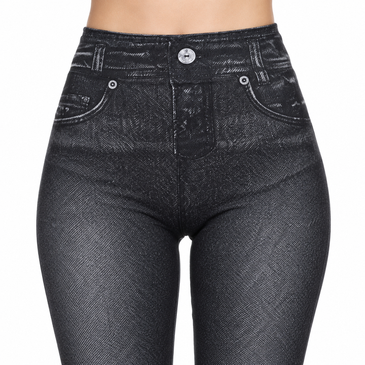 Black high waisted jeggings close-up with the front waistband, button, faux fly and printed pocket details clearly visible.