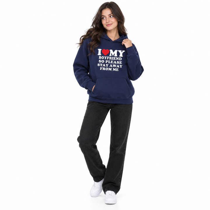Second woman wearing navy boyfriend quote hoodie on white background