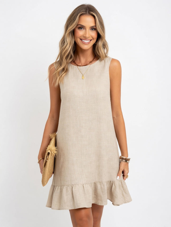 Summer ruffle dress women outdoor beach setting casual daytime loose silhouette effortless vacation-ready look
